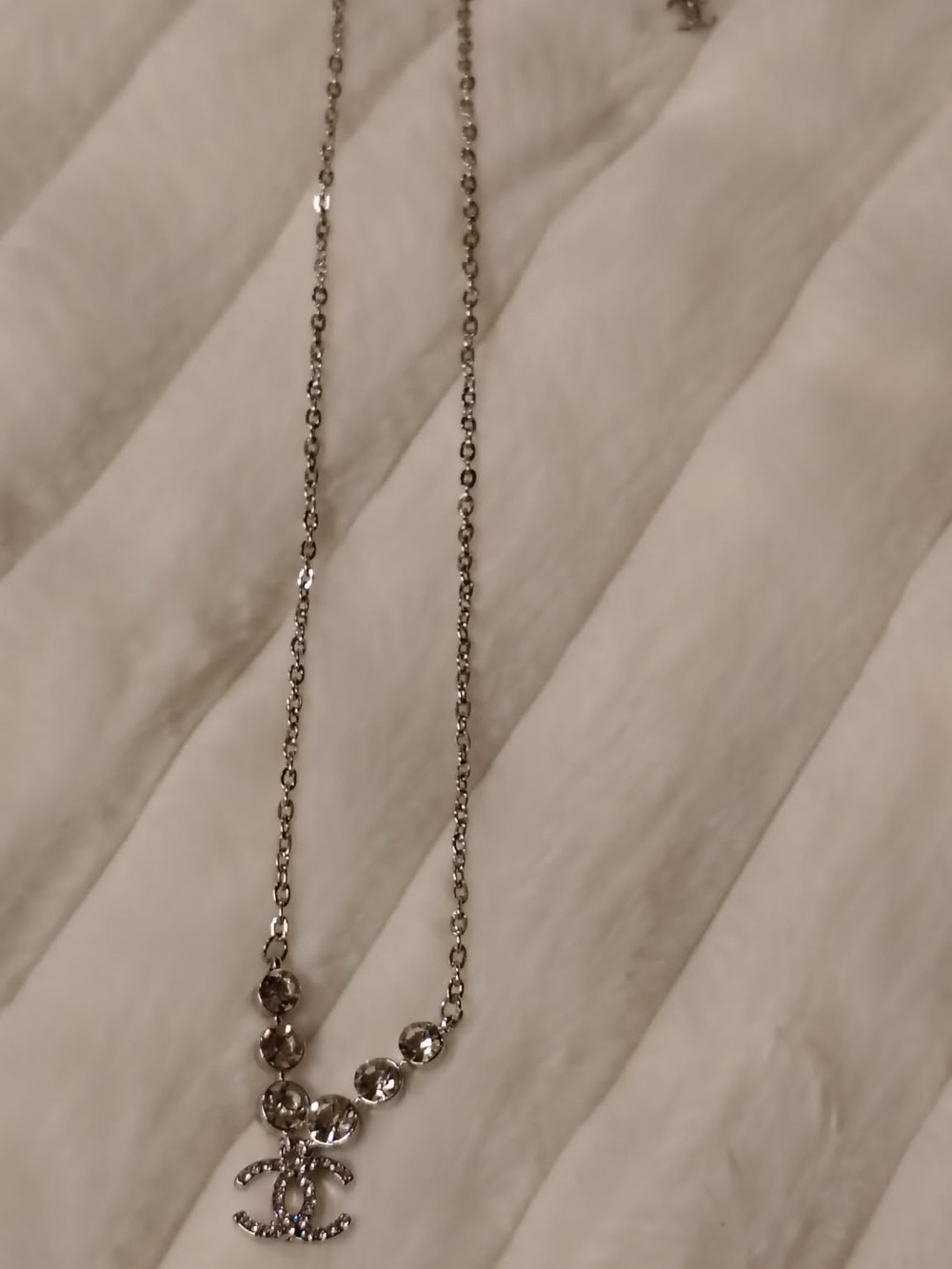 Silver Crystal Pendant Necklace with Interlocking Logo Accent